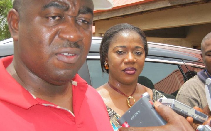 Gabriel Suswan, governor of Benue state, in red t-shirt and flanked by wife at the Makurdi Government House Polling Unit during the 2011 general elections. Photo: Emmanuel Ogala