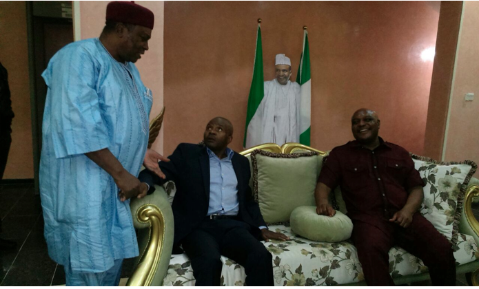 Governor Danbaba Suntai discussing with an aide shortly after arriving Abuja from London for medical checkup on Monday... Picture: Ibanga Isine (PREMIUM TIMES)