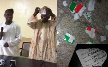 Former President Olusegun Obasanjo tearing his PDP membership card into shreds