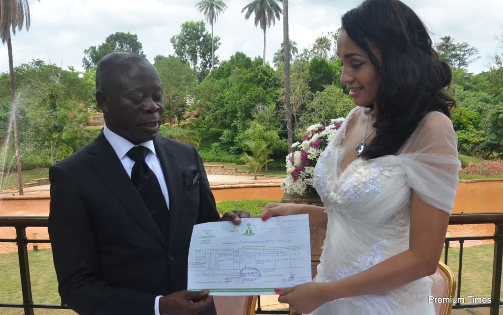 Mr and Mrs Adams Oshiomhole display their wedding certificate.