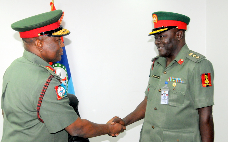 Major General Chris Olukolade handing over to  Colonel Rabe Abubakar
