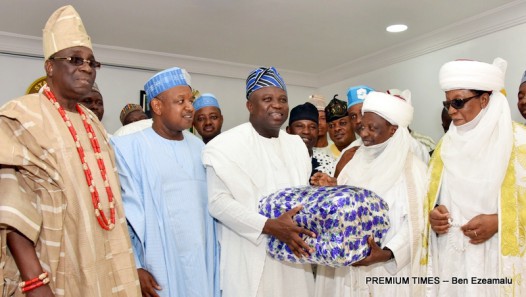 Lagos State Governor, Mr. Akinwunmi Ambode (middle), being presented with a gift by Emir of Gwandu & Chairman, Kebbi State Council of Chiefs, Alhaji Muhammad Bashar(2nd right) during the signing of Memorandum of Understanding on the Development of Commodity Value Chains between Lagos and Kebbi States at the Lagos House, Ikeja, on Wednesday, March 23, 2016. (L-R) With them are Oba of Lagos, Oba Rilwan Akiolu I; Kebbi State Governor, Alhaji Atiku Bagudu and Emir of Zuru, Major General Muhammad Sani Sami (rtd).