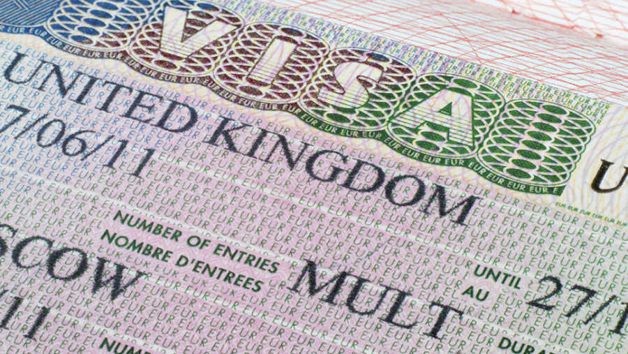 Close up United Kingdom visa in passport used to illustrate the story