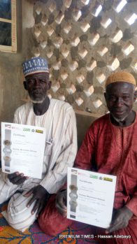 Alhaji Shehe displaying certificate of participation in an ABP training programme