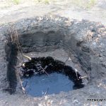 Puddled allegedly dug by Shell filled with spilled oil at at oil well inn K-Dere, Ogoni land