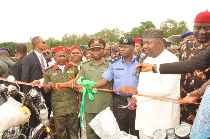 Gov. Ifeanyi Ugwuanyi of Enugu State cutting the tape to launch the
state’s Security/Neighbourhood Watch Endowment Fund at Michael Okpara
Square Enugu, yesterday.  With him from the right are the Speaker, Enugu
State House of Assembly, Rt. Hon. Edward Ubosi; the Commissioner of Police, Enugu State,  Mr. Dan Mallam Mohammed; the Garrison Commander, Nigeria Army 82 Division; the state's Commissioner for Human Capital Development, Hon. Obinna Mbeke