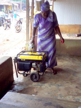 a tailor filling her generator with fuel for the day