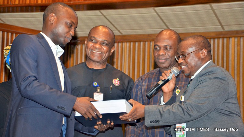 (R-L) Group Managing Director, NNPC, Maikanti Baru, General Manager, Commercial in Crude Oil Marketing Division, NNPC, Adokiye Tombomieye, Chief Operating Officer Commercials Henry Ikem Obih, and an official of one of the bidding companies for the 2018/2019 crude term contracts on Tuesday in Abuja.