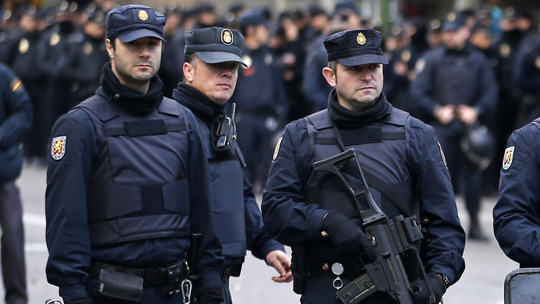 FILE PHOTO: Police stand outside Real Madrid's Santiago Bernabeu stadium in Madrid, Spain, Saturday, Nov. 21, 2015. Unprecedented security measures are in place for the first clasico of the season between Real Madrid and Barcelona, with nearly 3,000 policemen and private security officers dispatched to guarantee public safety at the Santiago Bernabeu stadium in Madrid. (AP Photo/Paul White)
