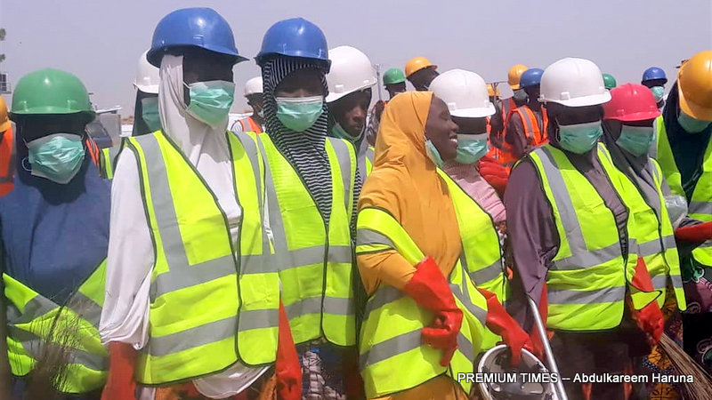 IDPs equipped with safety gears to clean up their communities