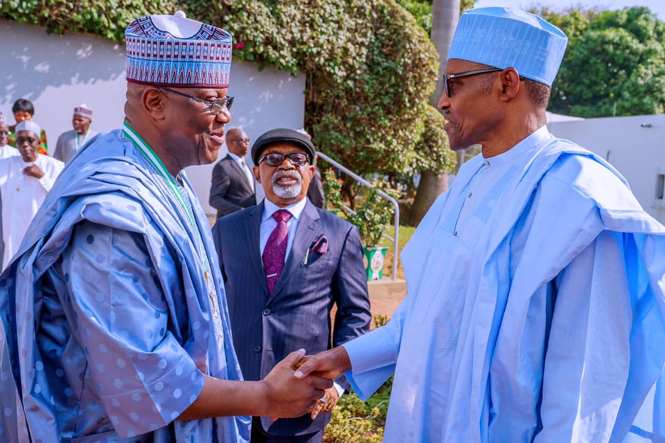 FILE: President Buhari with Minister of Labour Chris Ngige and Chairman Channels TV John Momoh after receiving in audience Awardees of National Productivity Order of Merit Award