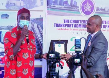 Minister of Transport Rt. Hon. Rotimi Chibuike Amaechi (L) receiving a plaque from the President of Chartered Institute of Transport Administration of Nigeria (CIoTA) Dr. Bashir Jamoh during the second National Transport Summit organized by CIoTA in Abuja.