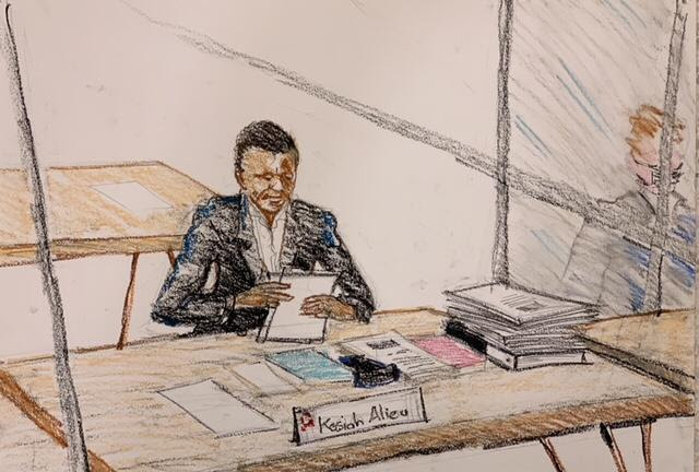 Alieu Kosiah listens to testimony during his war crimes trial. Leslie Lumeh/New Narratives