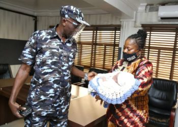 The baby being handed to the office of the Commissioner of Police, Lagos State, CP Hakeem Odumosu