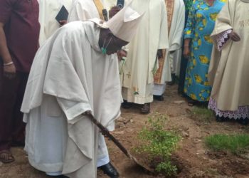 Kaigama planting a tree outside the premises of the Guardian Angel Catholic police Chapel Lugbe, as part of the event.