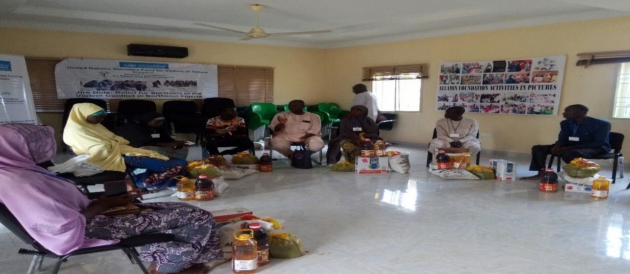 Programme Manager Allamin Foundation, Mohammed Laminu (In peach kaftan), cautioning the victims of insurgency currently receiving psychosocial support to eat a balanced diet and use their medication as prescribed.