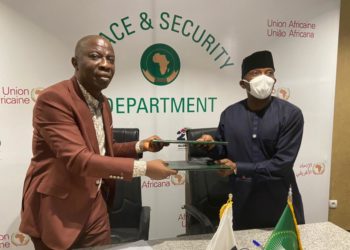 Dr. Olumide Abimbola Ajayi, Executive Director, (ALF) (left) exchanging the signed MoU with H.E. Ambassador Adeoye Bankole, AU Commissioner for Political Affairs, Peace and Security (PAPS)
