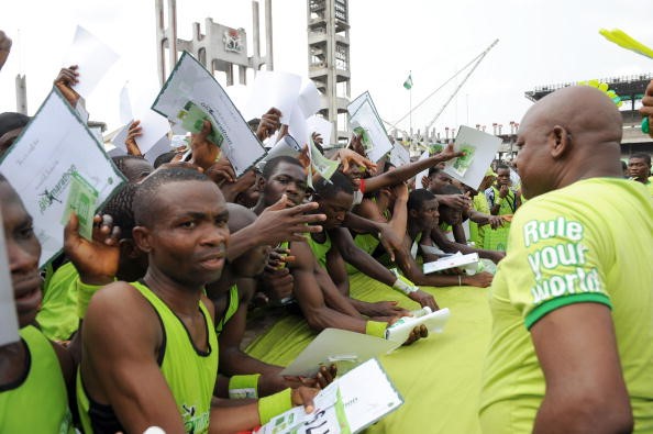 Participants collecting a certificate of participation and medals after the Glo Lagos International Half Marathon on February 21, 2009 in Lagos. Photo credit: PIUS UTOMI EKPEI/AFP via Getty Images