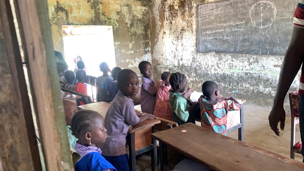 Pupils in their dilapidated classroom.