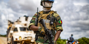 A Senegalese peacekeeper from the MINUSMA Quick Reaction Force (QRF) provides security for the convoy on the road from Bandiagara to Bankass in the Mopti region where improvised explosive devices (IEDs) and terrorist attacks are recurrent.