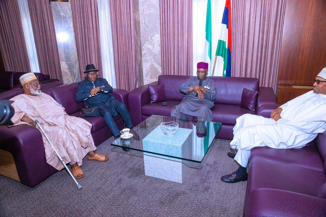President Buhari and other past leaders of Nigeria having a chat before the Council of State meeting 