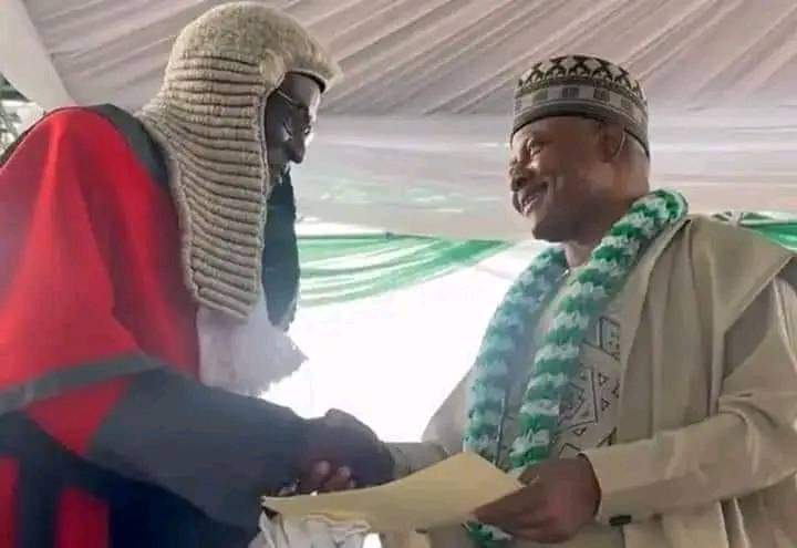Kaduna state Chief Judge exchange pleasantries with the just-inaugurated governor, Uba Sani during the inauguration ceremony of the later at Murtala Square, in Kaduna state.