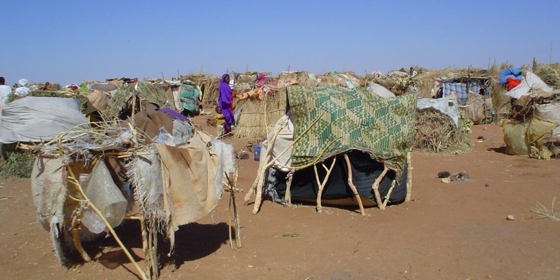 A refugee camp holding thousands of displaced Sudanese in the aftermath of war in the western part of Sudan. A long history of civil war, local tensions, government distrust, and new environmental pressures have scarred the country and brought about the world’s worst humanitarian crisis. (PHOTO CREDIT: USAID / Wikimedia Creative Commons)