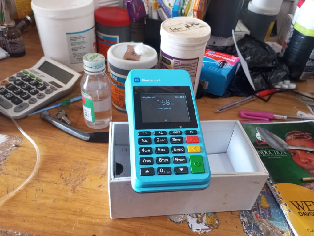 A Moniepoint PoS machine at Joyce Pius' Chemist