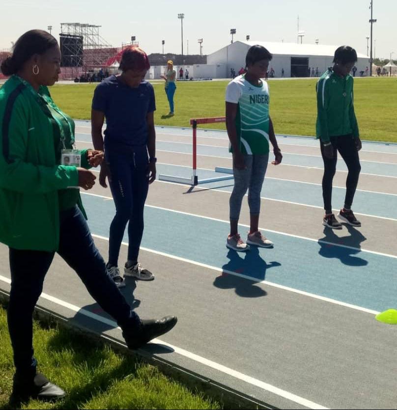 Coach Emilia Oyase (left) during a training session with some athletes. [Photo Credit: Emilia Oyase]