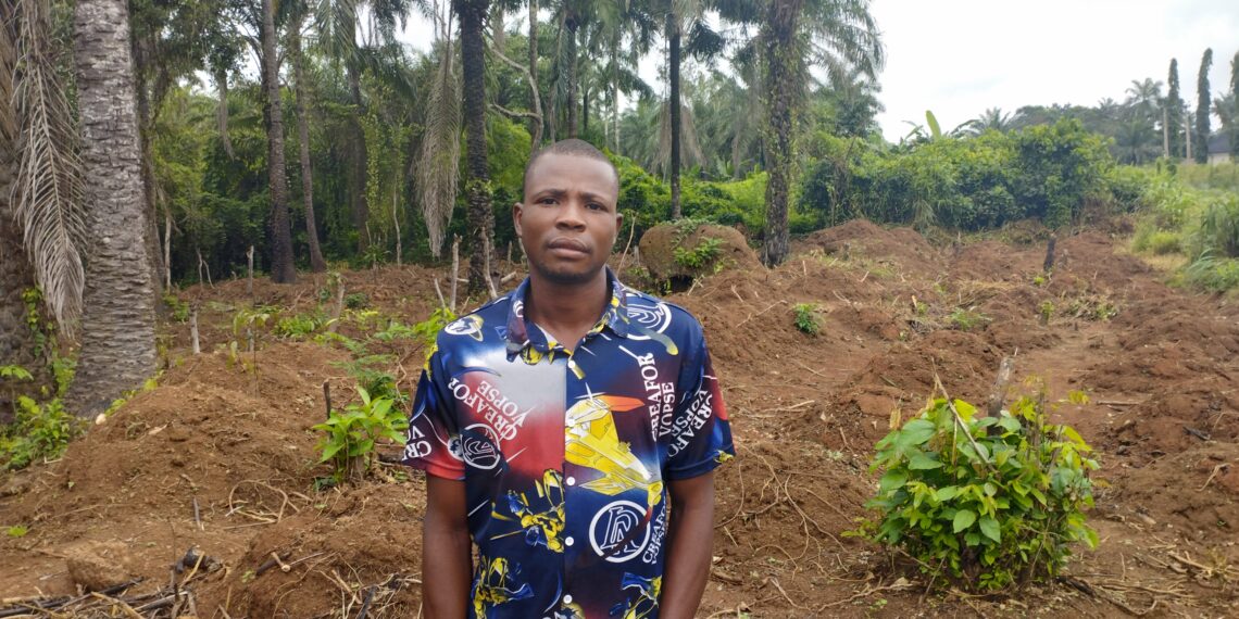 Divine Samuel in his cassava farmland [Photo Credit: Chinagorom Ugwu]