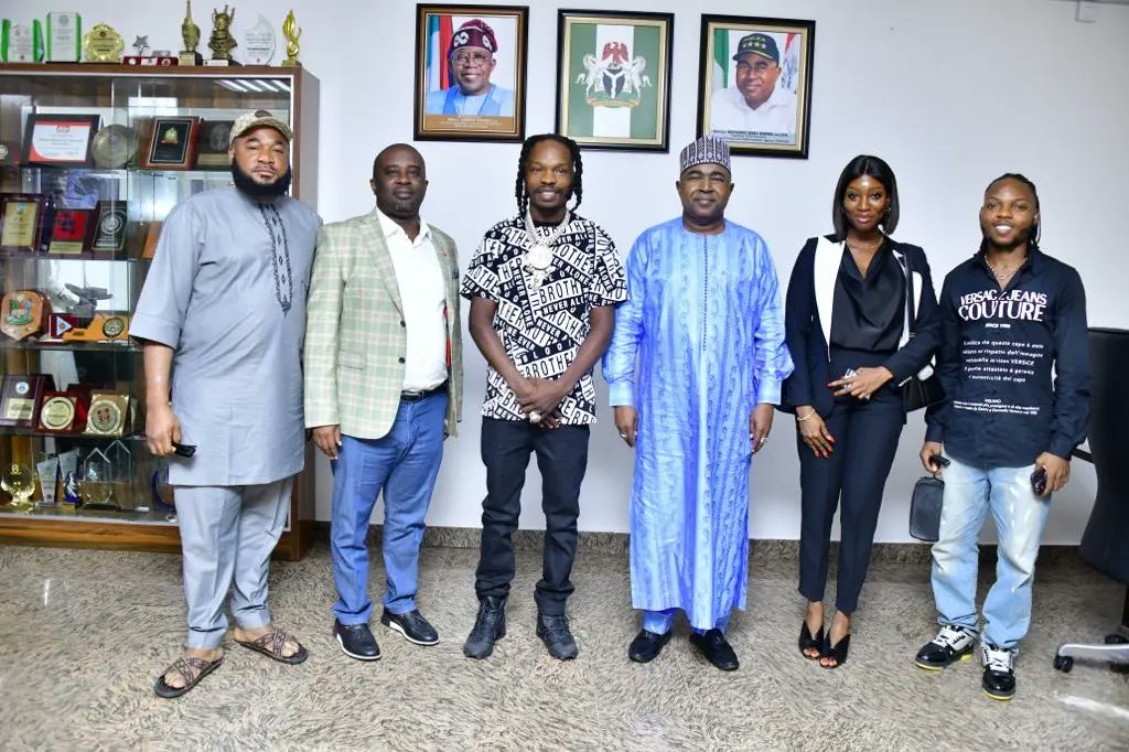 Chairman/Chief Executive Officer of the National Drug Law Enforcement Agency, Brig. Gen. Mohamed Buba Marwa (Retd) and music star, Naira Marley (both middle) flanked by the Agency's Director of Media and Advocacy, Femi Babafemi (2nd l) and other members of Marley's team