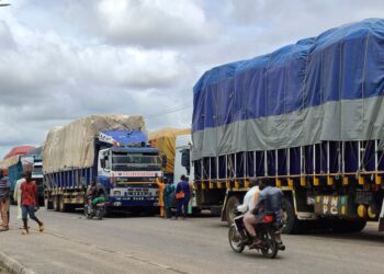 Trucks with goods used to illustrate the story